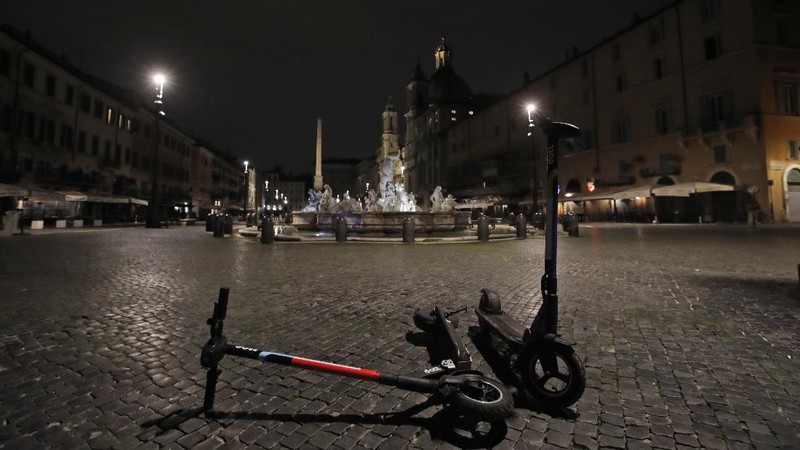 A view of an empty Piazza Navona Square after the start of a curfew, Saturday, Oct. 24, 2020. Italian Premier Giuseppe Conte, who imposed severe-stay-at-home limits on citizens early on, then gradually eased travel and other restrictions, has been leaving it up to regional governors in this current surge of infections to order restrictions such as overnight curfews, including in places like Rome, Milan and Naples. (AP Photo/Alessandra Tarantino)