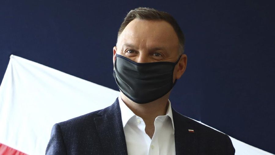 File—File picture taken June 28, 2020 shows Poland's President Andrzej Duda casting his vote during presidential election in Krakow, Poland. Duda was tested positive on Corona. (AP Photo/Beata Zawrzal, file)