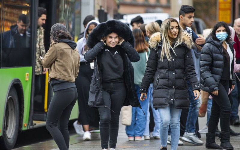 Workers walk over London Bridge towards the City of London financial district during the morning rush hour, in London, Monday, Jan. 24, 2022. The British government have asked people to return to working in offices starting Monday as they ease coronavirus restrictions. (AP Photo/Matt Dunham)