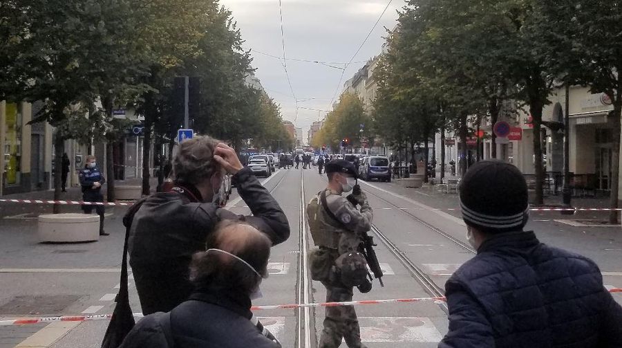 In this photo provided by Tom Vannier, police are at the scene of an attack in Nice, France, Thursday, Oct. 29, 2020. An attacker armed with a knife killed three people at a church in the Mediterranean city of Nice, the third attack in two months in France. The assailant was shot by police and hospitalized after the killings at the Notre Dame Church on Thursday. (Tom Vannier via AP)