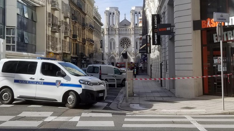 French policemen stand next to Notre Dame church after a knife attack, in Nice, France, Thursday, Oct. 29, 2020. French anti-terrorism prosecutors are investigating a knife attack at a church in the Mediterranean city of Nice that killed two people and injured several others. (AP Photo/Alexis Gilli)