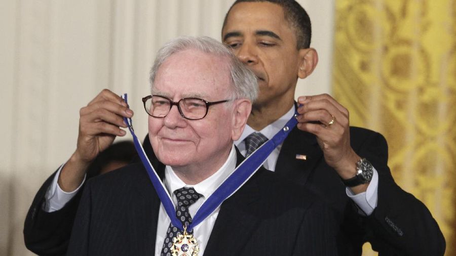 President Barack Obama presenst a 2010 Presidential Medal of Freedom to Warren Buffett, Tuesday, Feb. 15, 2011, during a ceremony in the East Room of the White House in Washington. (AP Photo/Carolyn Kaster)