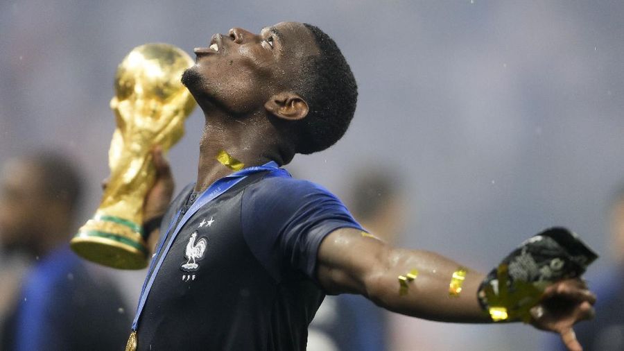 France's Paul Pogba celebrates with the trophy after the final match between France and Croatia at the 2018 soccer World Cup in the Luzhniki Stadium in Moscow, Russia, Sunday, July 15, 2018. (AP Photo/Natacha Pisarenko)