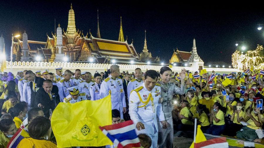 King Maha Vajiralongkorn and Queen Suthida greet supporters in Bangkok, Thailand, Sunday, Nov. 1, 2020. Under increasing pressure from protesters demanding reforms to the monarchy, Thailand's king and queen met Sunday with thousands of adoring supporters in Bangkok, mixing with citizens in the street after attending a religious ceremony inside the Grand Palace. (AP Photo/Wason Wanichakorn)
