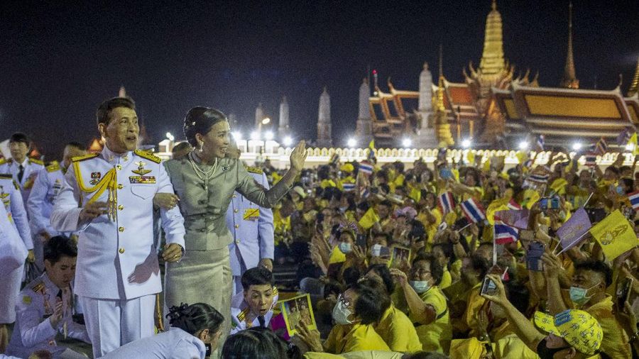 King Maha Vajiralongkorn and Queen Suthida greet supporters in Bangkok, Thailand, Sunday, Nov. 1, 2020. Under increasing pressure from protesters demanding reforms to the monarchy, Thailand's king and queen met Sunday with thousands of adoring supporters in Bangkok, mixing with citizens in the street after attending a religious ceremony inside the Grand Palace. (AP Photo/Wason Wanichakorn)