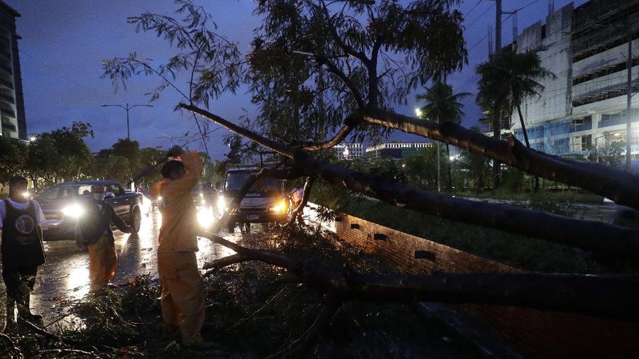 An All-Terrain Vehicle is toppled by strong winds and floods from Typhoon Goni as it hits Daraga, Albay province, central Philippines, Sunday, Nov. 1, 2020. The super typhoon slammed into the eastern Philippines with ferocious winds early Sunday and about a million people have been evacuated in its projected path, including in the capital where the main international airport was ordered closed. (AP Photo)