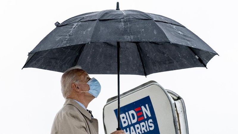 FILE - In this Saturday, Oct. 17, 2020, file photo a poll worker displays 