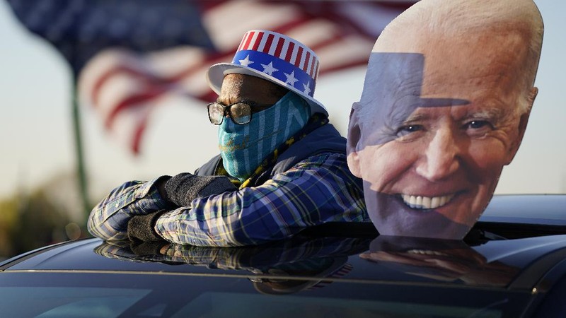 FILE - In this Saturday, Oct. 17, 2020, file photo a poll worker displays 