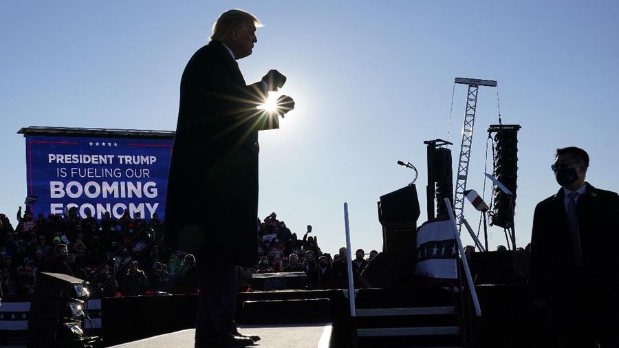 President Donald Trump dances after speaking at a campaign rally at Green Bay Austin Straubel International Airport, Friday, Oct. 30, 2020, in Green Bay, Wis. (AP Photo/Alex Brandon)