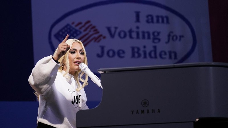 FILE - In this Saturday, Oct. 17, 2020, file photo a poll worker displays 