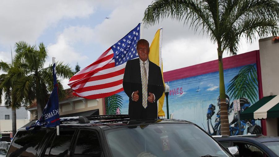 FILE - In this Saturday, Oct. 17, 2020, file photo a poll worker displays 