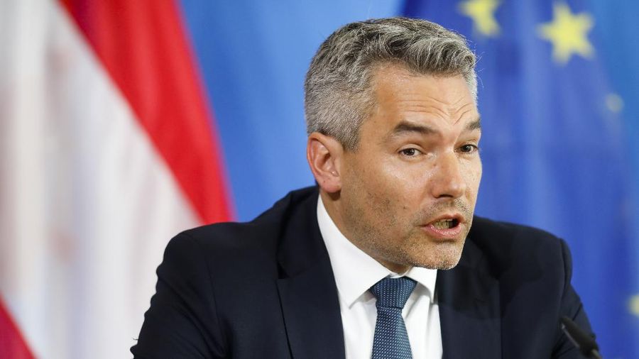 Interior Minister Karl Nehammer brief the media after a meeting with German Interior Minister Horst Seehofer at the Interior Ministry in Berlin, Germany, Wednesday, June 24, 2020. (AP Photo/Markus Schreiber, Pool)