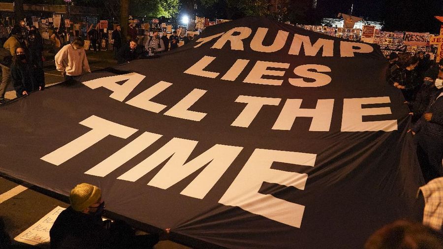 Demonstrators gather outside the White House, Tuesday, Nov. 3, 2020, in Washington. (AP Photo/Jacquelyn Martin)