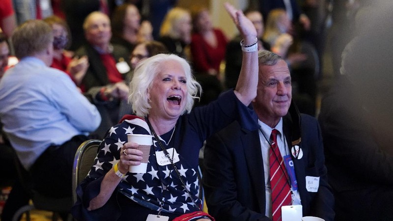 A man watches results come in on a screen set up at an election night gathering at Independence Mall , Tuesday, Nov. 3, 2020, in Philadelphia. (AP Photo/Michael Perez)