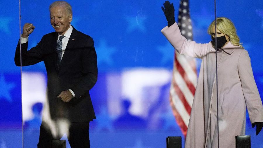 Democratic presidential candidate former Vice President Joe Biden and his wife Jill Biden wave to supporters, Tuesday, Nov. 3, 2020, in Wilmington, Del. (AP Photo/Andrew Harnik)