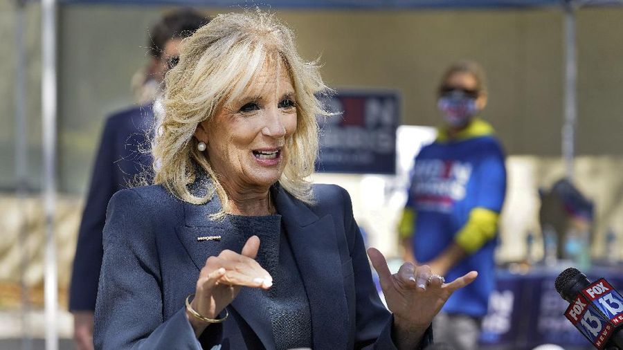 Jill Biden speaks to reporters while campaigning for her husband Democratic presidential candidate and former Vice President Joe Biden, during a voting poll meet and greet Tuesday, Nov. 3, 2020, in St. Petersburg, Fla. (AP Photo/Chris O'Meara)
