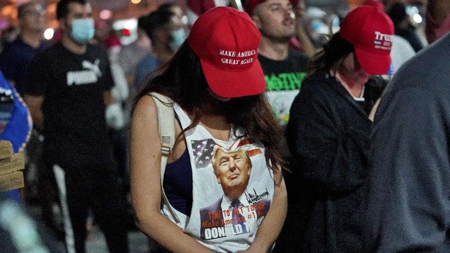 Pro Trump supporters rally outside the Maricopa County Recorders Office, Thursday, Nov. 5, 2020, in Phoenix. (AP Photo/Matt York)