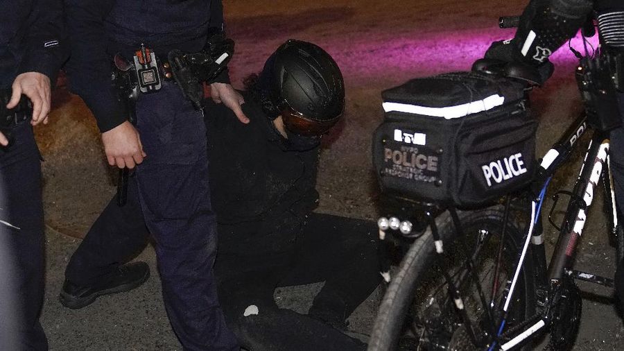 New York Police bike patrol officers make an arrest during a demonstration, Thursday, Nov. 5, 2020, in New York. (AP Photo/Seth Wenig)
