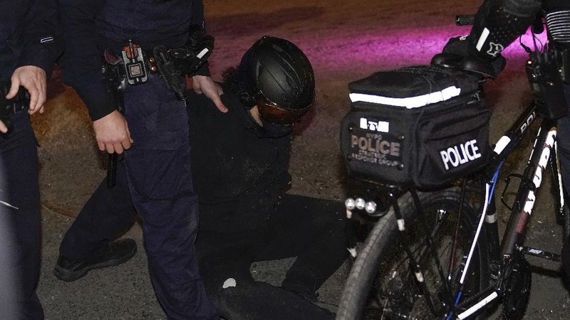 New York Police bike patrol officers make an arrest during a demonstration, Thursday, Nov. 5, 2020, in New York. (AP Photo/Seth Wenig)