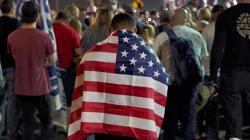 Pro Trump supporters rally outside the Maricopa County Recorders Office, Thursday, Nov. 5, 2020, in Phoenix. (AP Photo/Matt York)