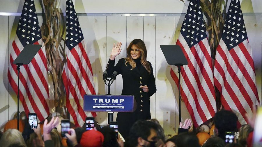 First lady Melania Trump waves to supporters as she exits the stage at Whitewoods in Hollenback Twp., Pa. Saturday, Oct. 31, 2020. (Sean McKeag/The Citizens' Voice via AP)