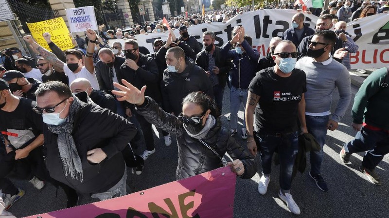 Taxi drivers stage a protest against limitations and the curfew imposed by the government in the effort to curb COVID-19 spread, in Rome Friday, Nov. 6, 2020. (AP Photo/Andrew Medichini)