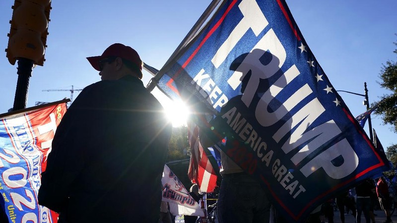 Supporters of President Donald Trump yell at supporters of President-elect Joe Biden as they protest near the state capitol, Saturday, Nov. 7, 2020, in Austin, Texas. (AP Photo/Eric Gay)