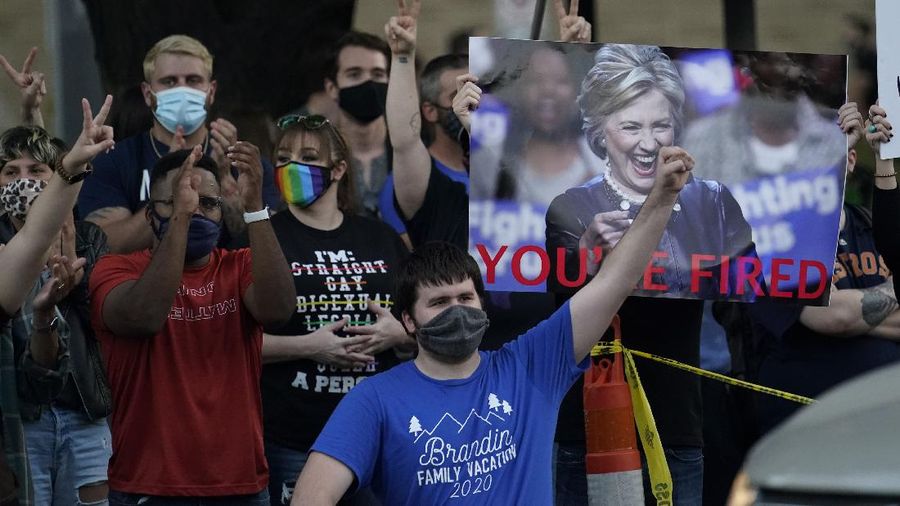 Supporters of President Donald Trump yell at supporters of President-elect Joe Biden as they protest near the state capitol, Saturday, Nov. 7, 2020, in Austin, Texas. (AP Photo/Eric Gay)