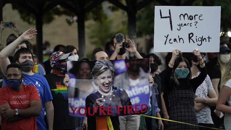 Supporters of President Donald Trump yell at supporters of President-elect Joe Biden as they protest near the state capitol, Saturday, Nov. 7, 2020, in Austin, Texas. (AP Photo/Eric Gay)