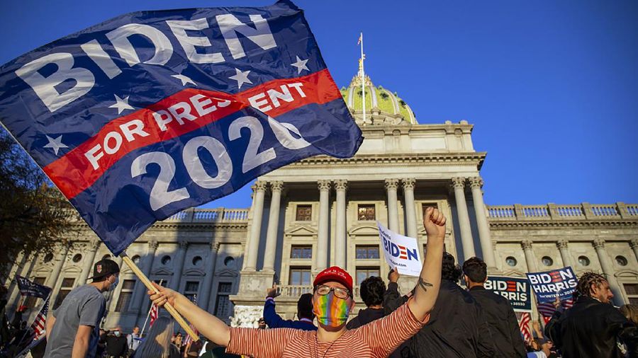 Dailey Monroe, of Harrisburg, waves a 