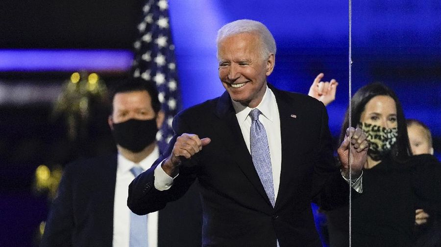 President-elect Joe Biden reacts as he stands on stage after speaking Saturday, Nov. 7, 2020, in Wilmington, Del. (AP Photo/Andrew Harnik)