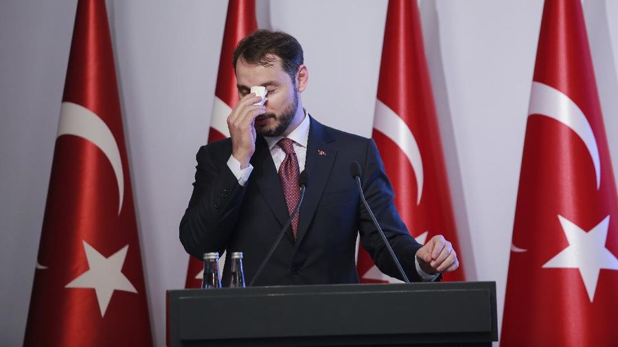 FILE - In this Friday, Aug. 10, 2018 file photo, Berat Albayrak, Turkey's Treasury and Finance Minister, wipes his forehead as he talks during a conference to ease investor concerns about Turkey's economic policy. Albayrak, announced his resignation on social media Sunday, Nov. 8, 2020. He said on Instagram that he was stepping down from his post for health reasons and would spend more time with his family. Albayrak, 42, was appointed minister of finance and treasury in July 2018, having previously been energy minister for nearly three years. (AP Photo/Mucahid Yapici, File)
