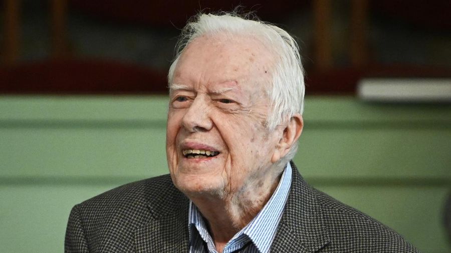 FILE - In this Nov. 3, 2019 file photo, former President Jimmy Carter teaches Sunday school at Maranatha Baptist Church in Plains, Ga.   Carter was released from Emory University Hospital on Wednesday, Nov. 27,  after recovering from surgery to relieve pressure on his brain caused by bleeding from a fall. Carter Center spokeswoman Deanna Congileo said the Carters “look forward to enjoying Thanksgiving at home in Plains, where he will continue to recover.” (AP Photo/John Amis, File)