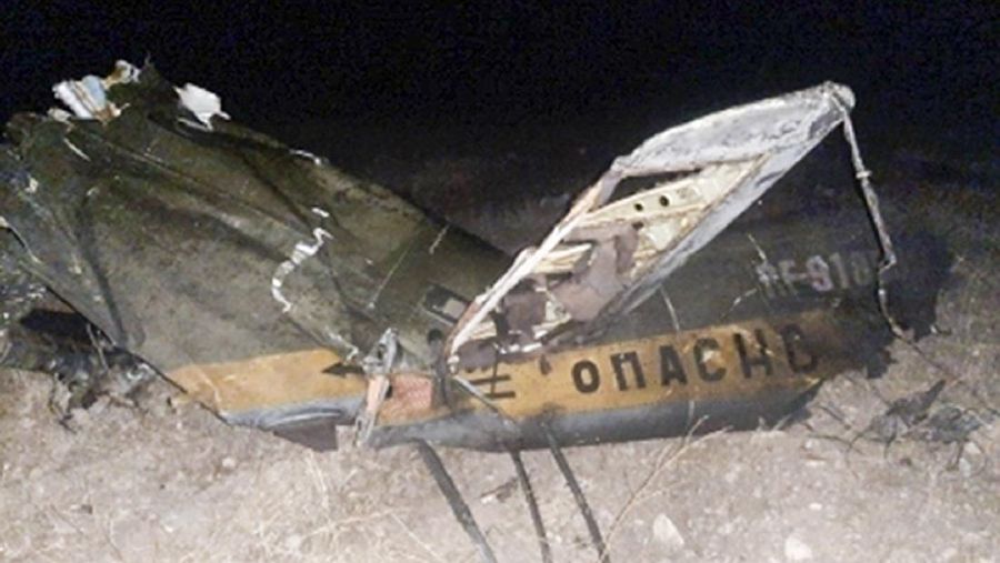 In this handout photo released by Armenian Emergency Ministry Press Office on Monday, Nov. 9, 2020, shows wreckage of a downed Russian military helicopter which was shot down in Armenia near the border with Azerbaijan. Two servicemen were killed, but the Russian Defense Ministry said the aircraft was outside the conflict area. The helicopter was downed near the border with Nakhcivan, an exclave of Azerbaijan surrounded by Armenia, Turkey and Iran. It was not clear who shot it down. (Armenian Emergency Ministry Press Office via AP)