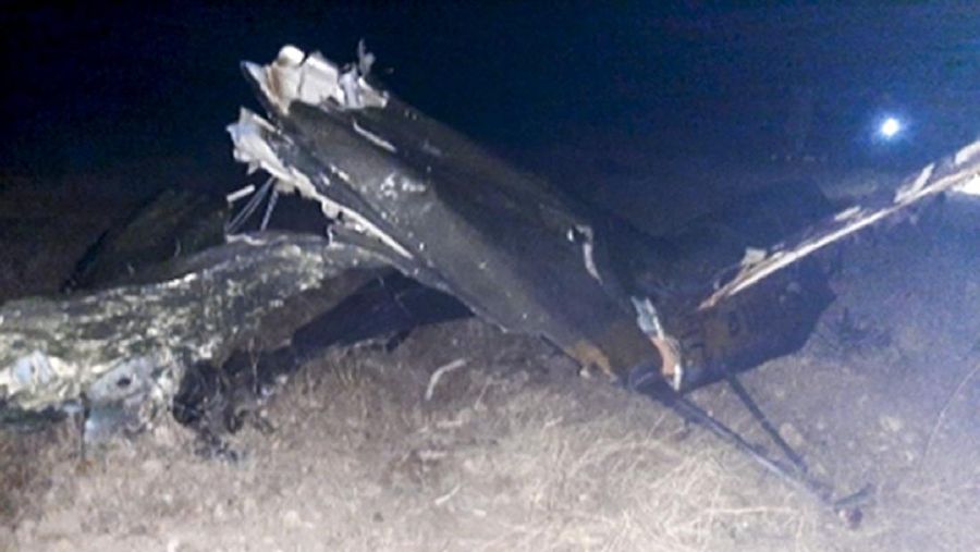 In this handout photo released by Armenian Emergency Ministry Press Office on Monday, Nov. 9, 2020, shows wreckage of a downed Russian military helicopter which was shot down in Armenia near the border with Azerbaijan. Two servicemen were killed, but the Russian Defense Ministry said the aircraft was outside the conflict area. The helicopter was downed near the border with Nakhcivan, an exclave of Azerbaijan surrounded by Armenia, Turkey and Iran. It was not clear who shot it down. (Armenian Emergency Ministry Press Office via AP)