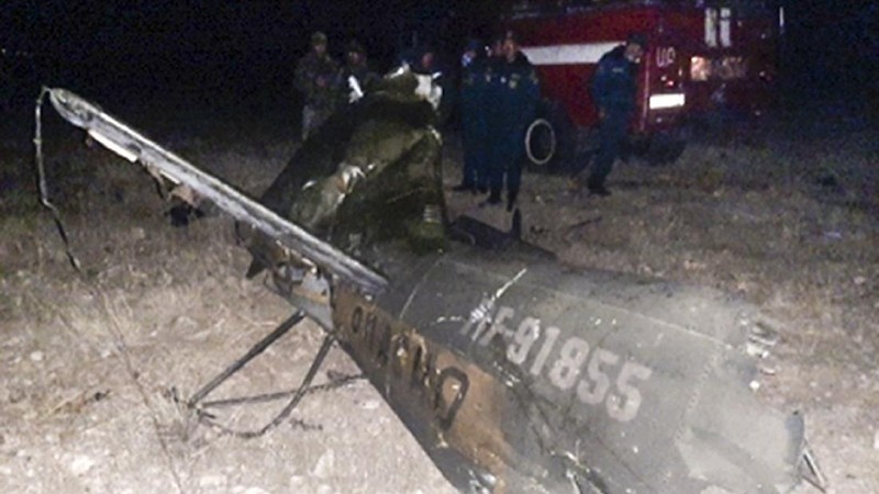 In this handout photo released by Armenian Emergency Ministry Press Office on Monday, Nov. 9, 2020, shows wreckage of a downed Russian military helicopter which was shot down in Armenia near the border with Azerbaijan. Two servicemen were killed, but the Russian Defense Ministry said the aircraft was outside the conflict area. The helicopter was downed near the border with Nakhcivan, an exclave of Azerbaijan surrounded by Armenia, Turkey and Iran. It was not clear who shot it down. (Armenian Emergency Ministry Press Office via AP)