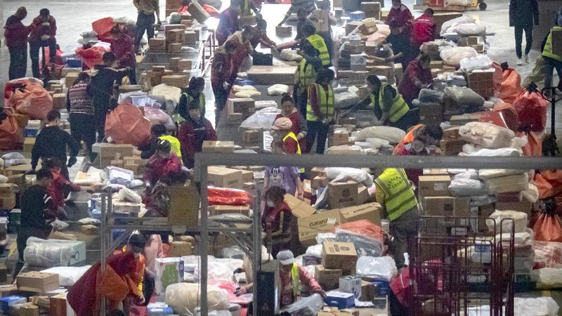 Workers monitor computers in a command center at the headquarters of online retailer JD.com in Beijing, Wednesday, Nov. 11, 2020. Chinese consumers are expected to spend tens of billions on everything from fresh food to luxury goods during this year's Singles' Day online shopping festival, as the country recovers from the pandemic. The shopping festival, which is the world's largest and typically begins in November, is an annual extravaganza where China's e-commerce companies offer generous discounts on their platforms. (AP Photo/Mark Schiefelbein)