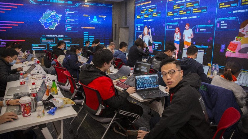 Workers monitor computers in a command center at the headquarters of online retailer JD.com in Beijing, Wednesday, Nov. 11, 2020. Chinese consumers are expected to spend tens of billions on everything from fresh food to luxury goods during this year's Singles' Day online shopping festival, as the country recovers from the pandemic. The shopping festival, which is the world's largest and typically begins in November, is an annual extravaganza where China's e-commerce companies offer generous discounts on their platforms. (AP Photo/Mark Schiefelbein)