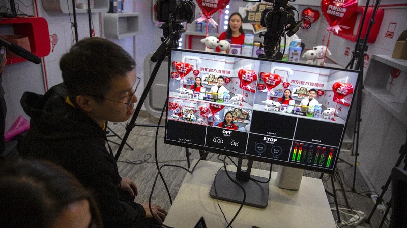 Workers monitor computers in a command center at the headquarters of online retailer JD.com in Beijing, Wednesday, Nov. 11, 2020. Chinese consumers are expected to spend tens of billions on everything from fresh food to luxury goods during this year's Singles' Day online shopping festival, as the country recovers from the pandemic. The shopping festival, which is the world's largest and typically begins in November, is an annual extravaganza where China's e-commerce companies offer generous discounts on their platforms. (AP Photo/Mark Schiefelbein)