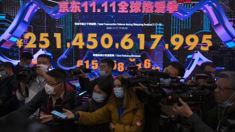 Workers monitor computers in a command center at the headquarters of online retailer JD.com in Beijing, Wednesday, Nov. 11, 2020. Chinese consumers are expected to spend tens of billions on everything from fresh food to luxury goods during this year's Singles' Day online shopping festival, as the country recovers from the pandemic. The shopping festival, which is the world's largest and typically begins in November, is an annual extravaganza where China's e-commerce companies offer generous discounts on their platforms. (AP Photo/Mark Schiefelbein)