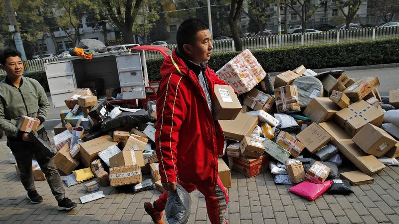 Workers monitor computers in a command center at the headquarters of online retailer JD.com in Beijing, Wednesday, Nov. 11, 2020. Chinese consumers are expected to spend tens of billions on everything from fresh food to luxury goods during this year's Singles' Day online shopping festival, as the country recovers from the pandemic. The shopping festival, which is the world's largest and typically begins in November, is an annual extravaganza where China's e-commerce companies offer generous discounts on their platforms. (AP Photo/Mark Schiefelbein)
