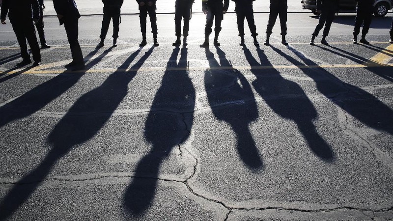 Protesters gather near the parliamentary building during a protest against an agreement to halt fighting over the Nagorno-Karabakh region, in Yerevan, Armenia, Wednesday, Nov. 11, 2020. Thousands of people flooded the streets of Yerevan once again on Wednesday, protesting an agreement between Armenia and Azerbaijan to halt the fighting over Nagorno-Karabakh, which calls for deployment of nearly 2,000 Russian peacekeepers and territorial concessions. Protesters clashed with police, and scores have been detained. (AP Photo/Dmitri Lovetsky)