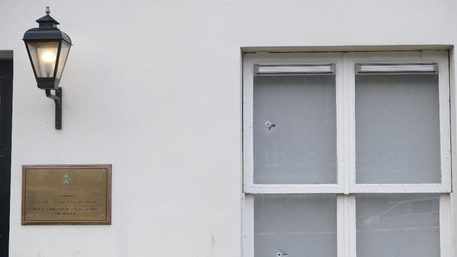 Bullet impacts are seen in the windows of Saudi Arabia's embassy in The Hague, Netherlands, Thursday, Nov. 12, 2020, after several shot were fired at the building early in the morning. Nobody was injured and police were investigating. (AP Photo/Mike Corder)