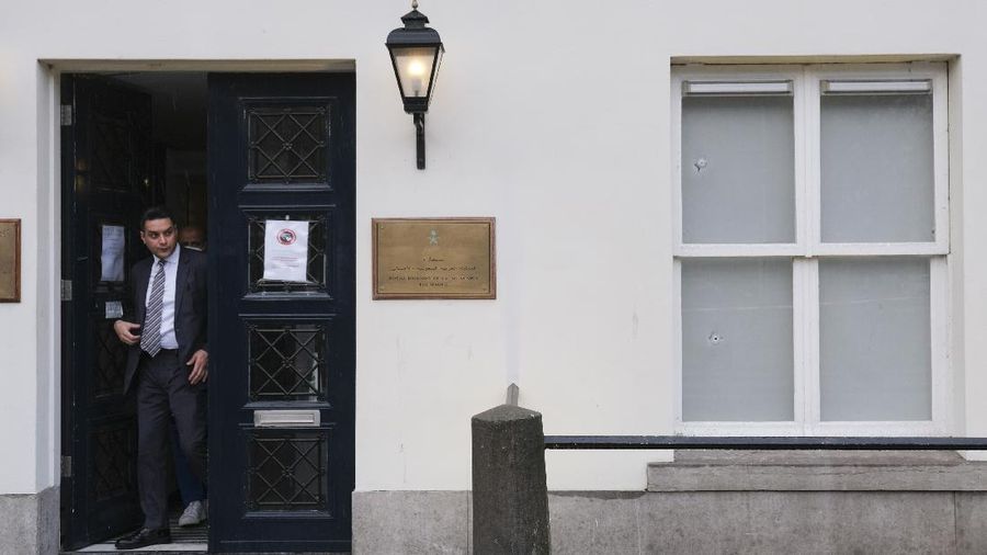 Bullet impacts are seen in the windows of Saudi Arabia's embassy in The Hague, Netherlands, Thursday, Nov. 12, 2020, after several shot were fired at the building early in the morning. Nobody was injured and police were investigating. (AP Photo/Mike Corder)