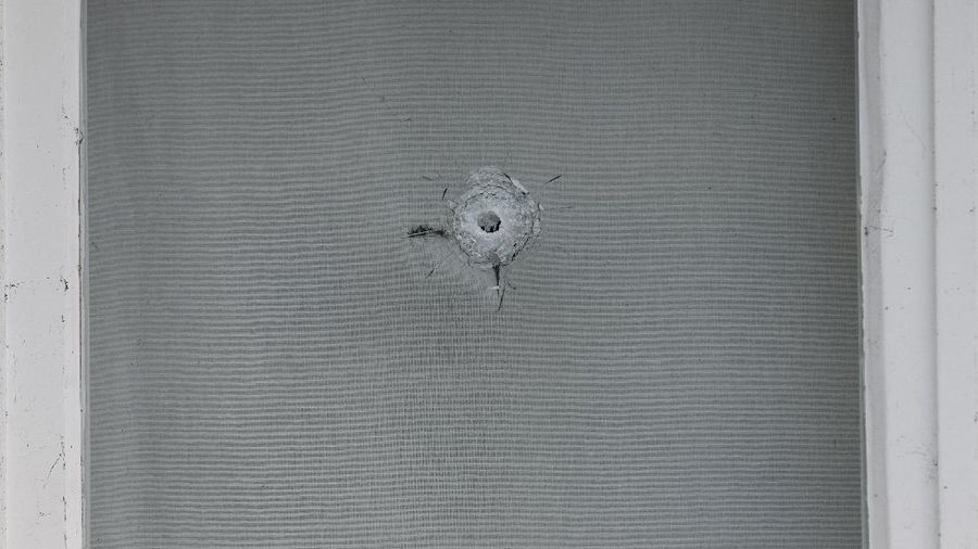 Bullet impacts are seen in the windows of Saudi Arabia's embassy in The Hague, Netherlands, Thursday, Nov. 12, 2020, after several shot were fired at the building early in the morning. Nobody was injured and police were investigating. (AP Photo/Mike Corder)