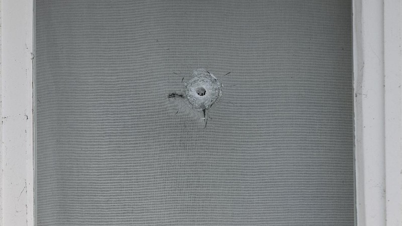 Bullet impacts are seen in the windows of Saudi Arabia's embassy in The Hague, Netherlands, Thursday, Nov. 12, 2020, after several shot were fired at the building early in the morning. Nobody was injured and police were investigating. (AP Photo/Mike Corder)