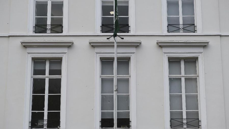 Bullet impacts are seen in the windows of Saudi Arabia's embassy in The Hague, Netherlands, Thursday, Nov. 12, 2020, after several shot were fired at the building early in the morning. Nobody was injured and police were investigating. (AP Photo/Mike Corder)