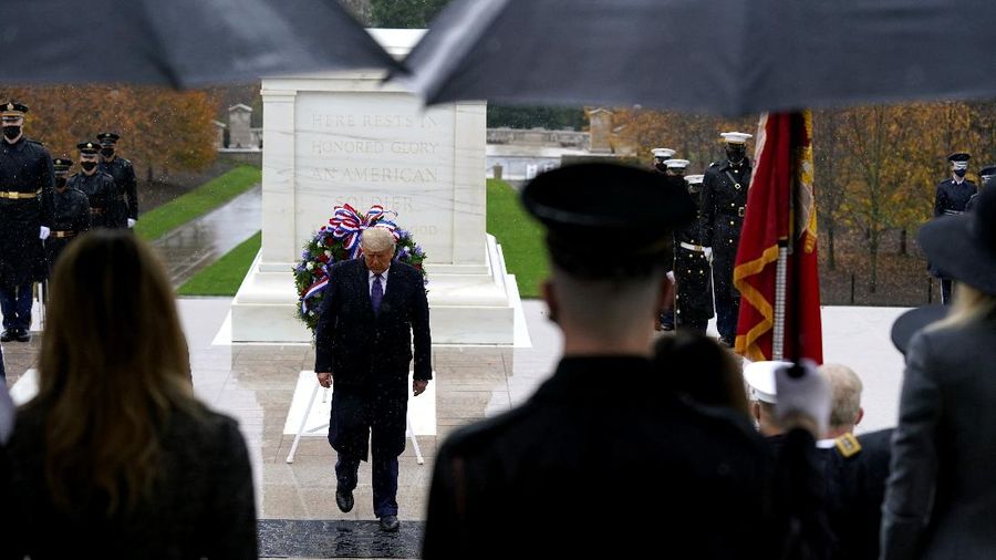 President Donald Trump participates in a Veterans Day wreath laying ceremony at the Tomb of the Unknown Soldier at Arlington National Cemetery in Arlington, Va., Wednesday, Nov. 11, 2020. (AP Photo/Patrick Semansky)