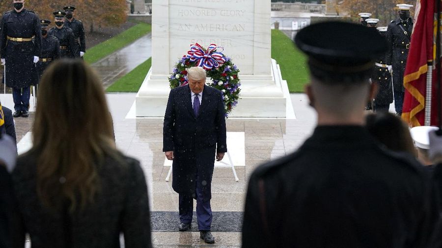 President Donald Trump participates in a Veterans Day wreath laying ceremony at the Tomb of the Unknown Soldier at Arlington National Cemetery in Arlington, Va., Wednesday, Nov. 11, 2020. (AP Photo/Patrick Semansky)