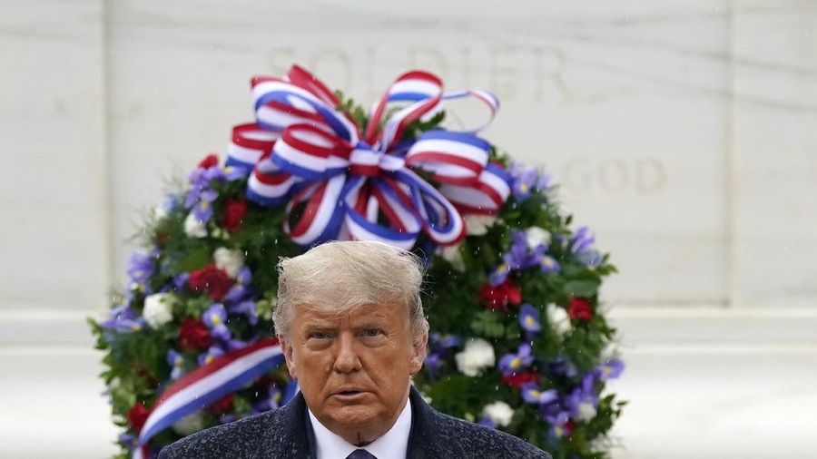 President Donald Trump participates in a Veterans Day wreath laying ceremony at the Tomb of the Unknown Soldier at Arlington National Cemetery in Arlington, Va., Wednesday, Nov. 11, 2020. (AP Photo/Patrick Semansky)